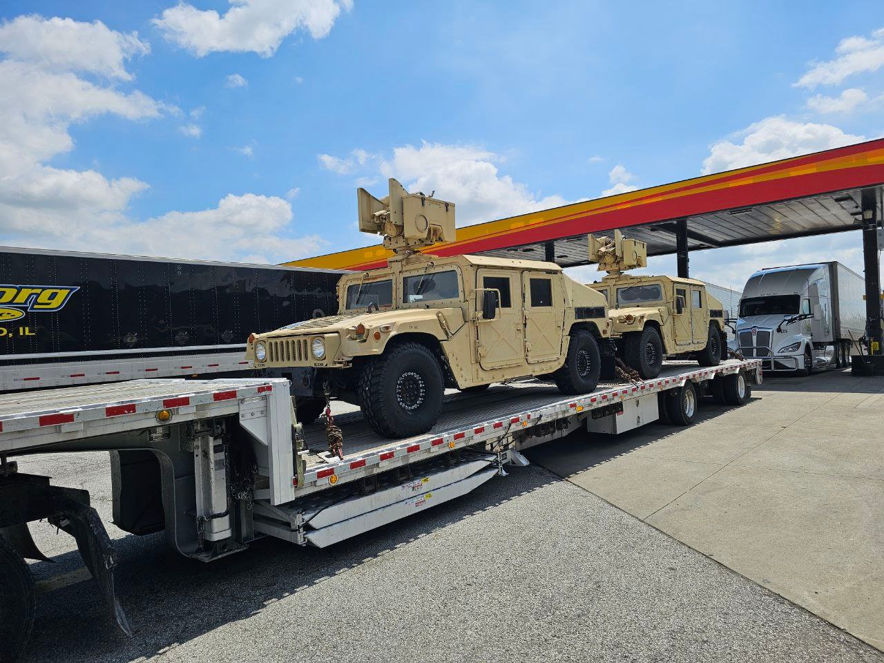 Military vehicles transported by Tigershark Express
