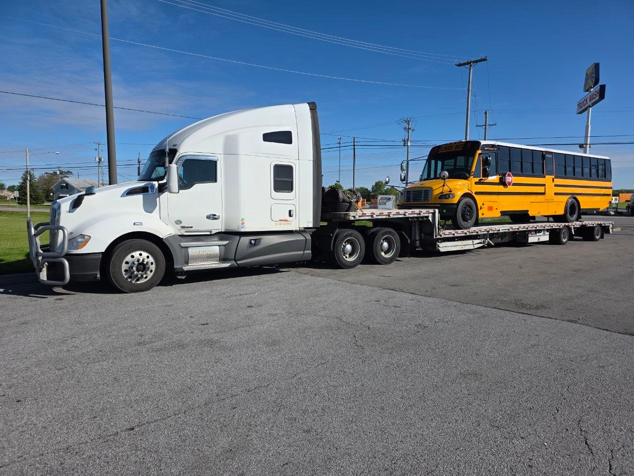 School bus transported on low-profile trailer
